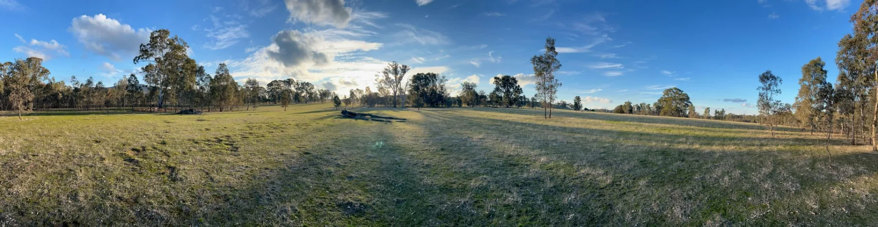 Peaceful country Victoria scenery — fields and hills under an open sky
